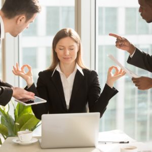 woman in office doing stress management